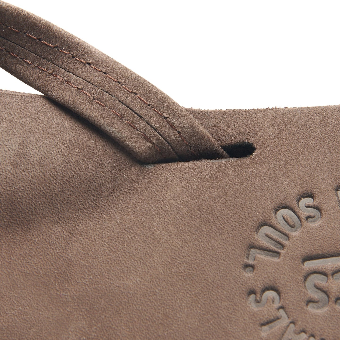 Suede flip-flop strap with stitching and embossed side branding; dark rubber sole