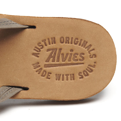 Close-up of gray flip-flop insole with “AUSTIN ORIGINALS” logo embossing