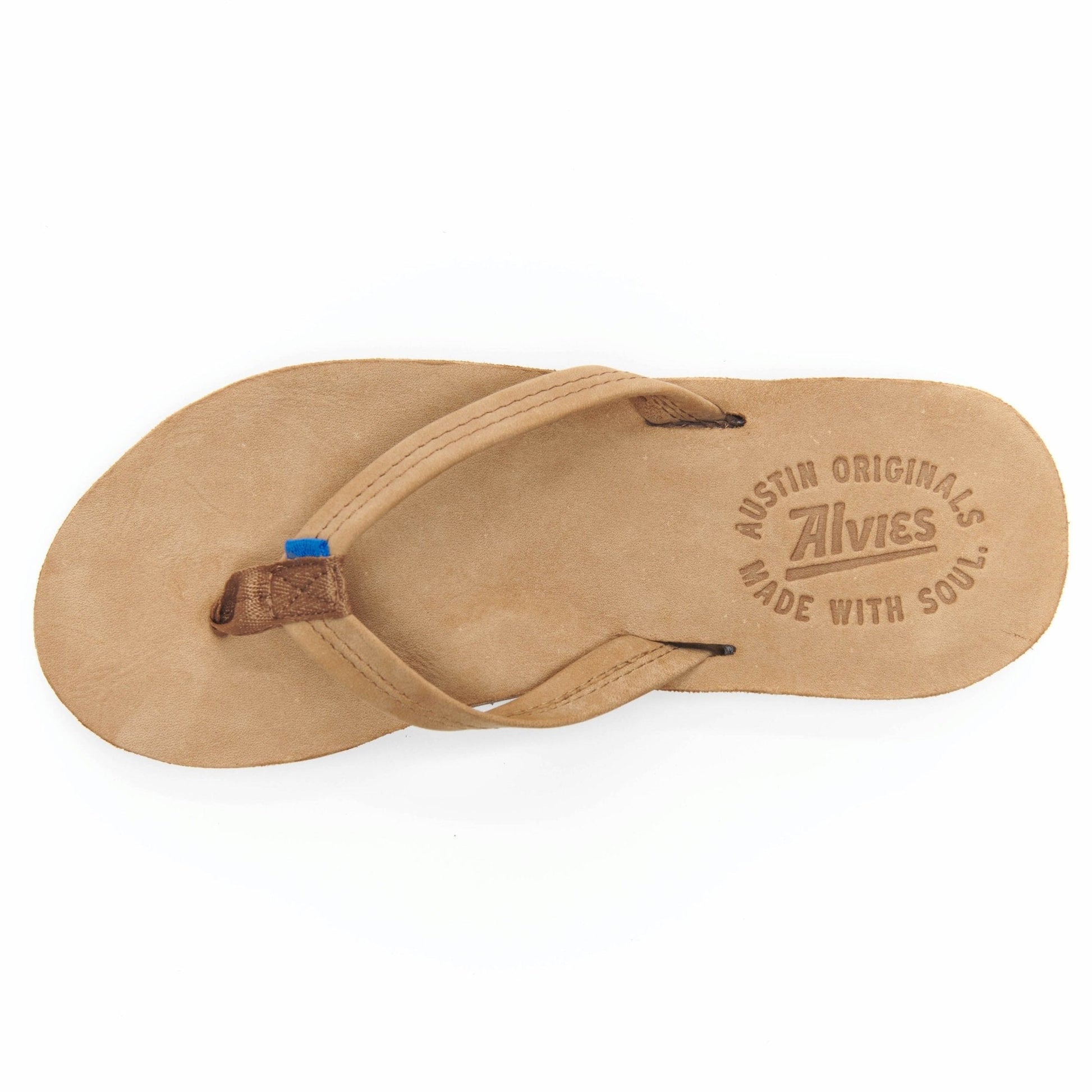 Tan flip-flop top view with embossed logo and toe strap with blue tab