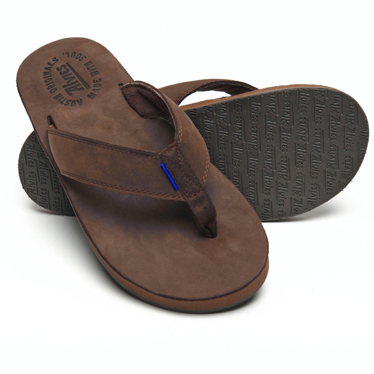 Brown thong sandals with textured outsole and blue stitch tab