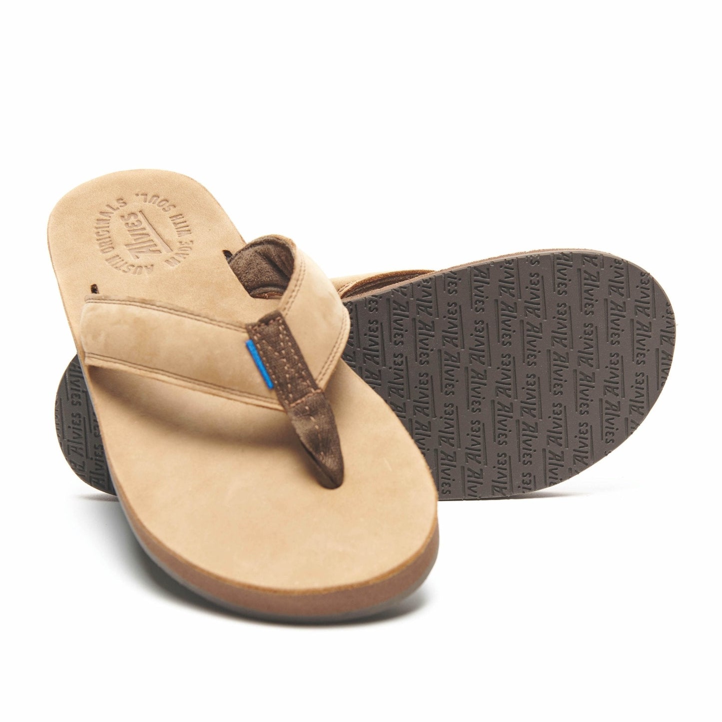 Tan flip-flops with dark thongs and blue accent detail, side view
