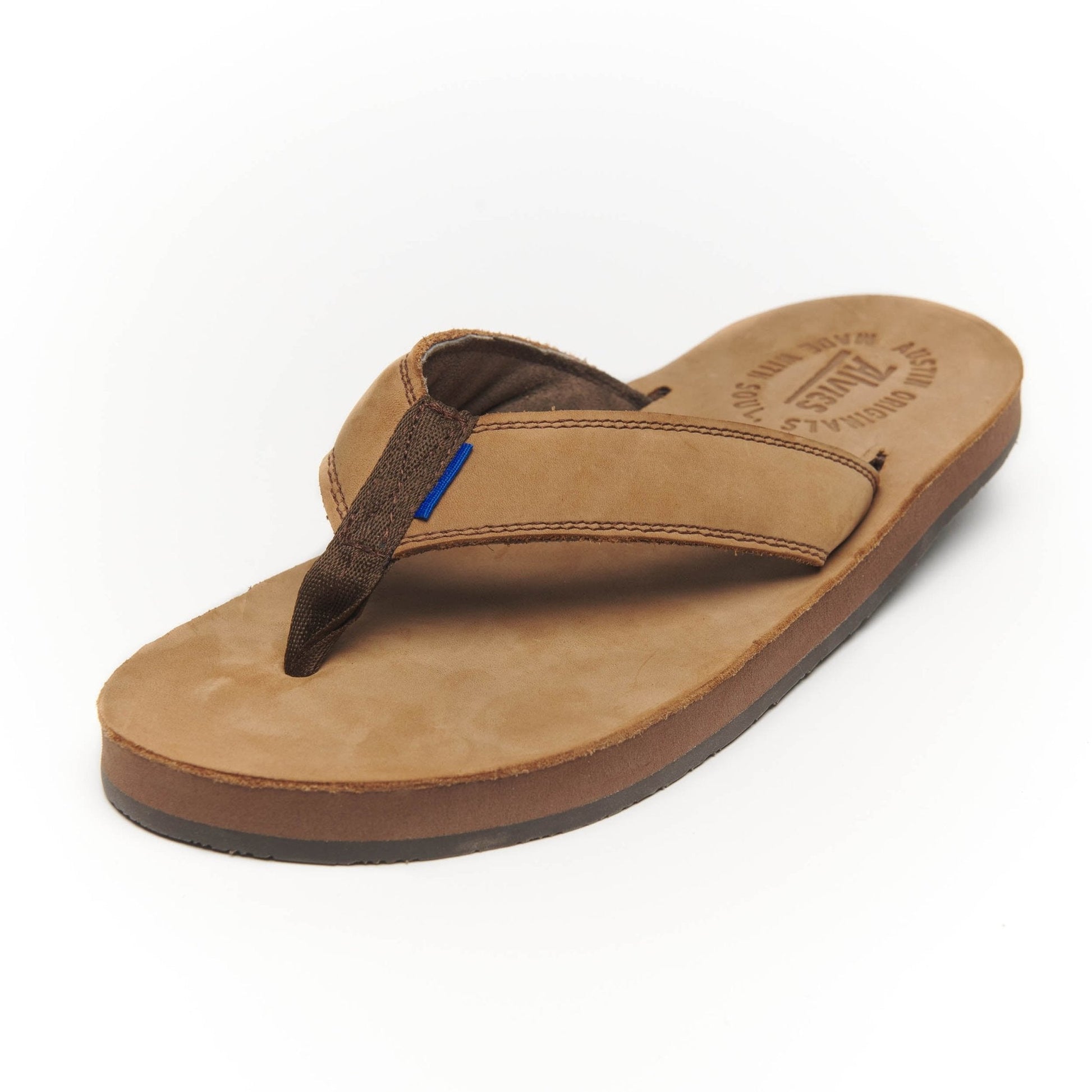Tan flip-flop sandal with dark V-thong strap and blue accent stitch