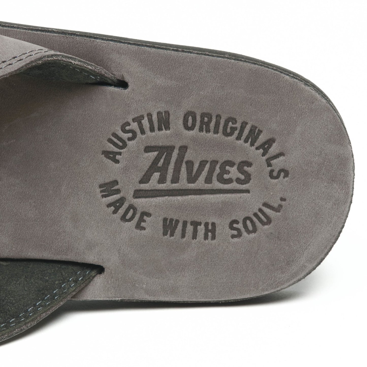 Gray flip-flop sandal footbed with embossed Austin Originals logo