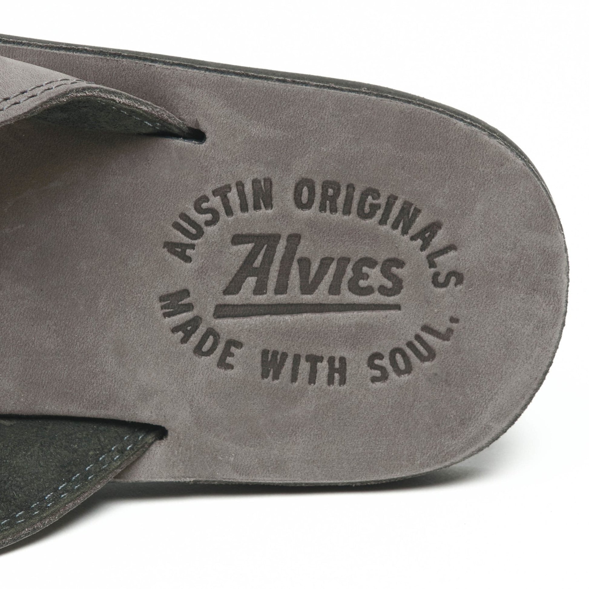 Gray flip-flop sandal footbed with embossed Austin Originals logo