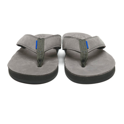 Pair of gray flip-flop sandals with greenish thong straps and blue accent tab