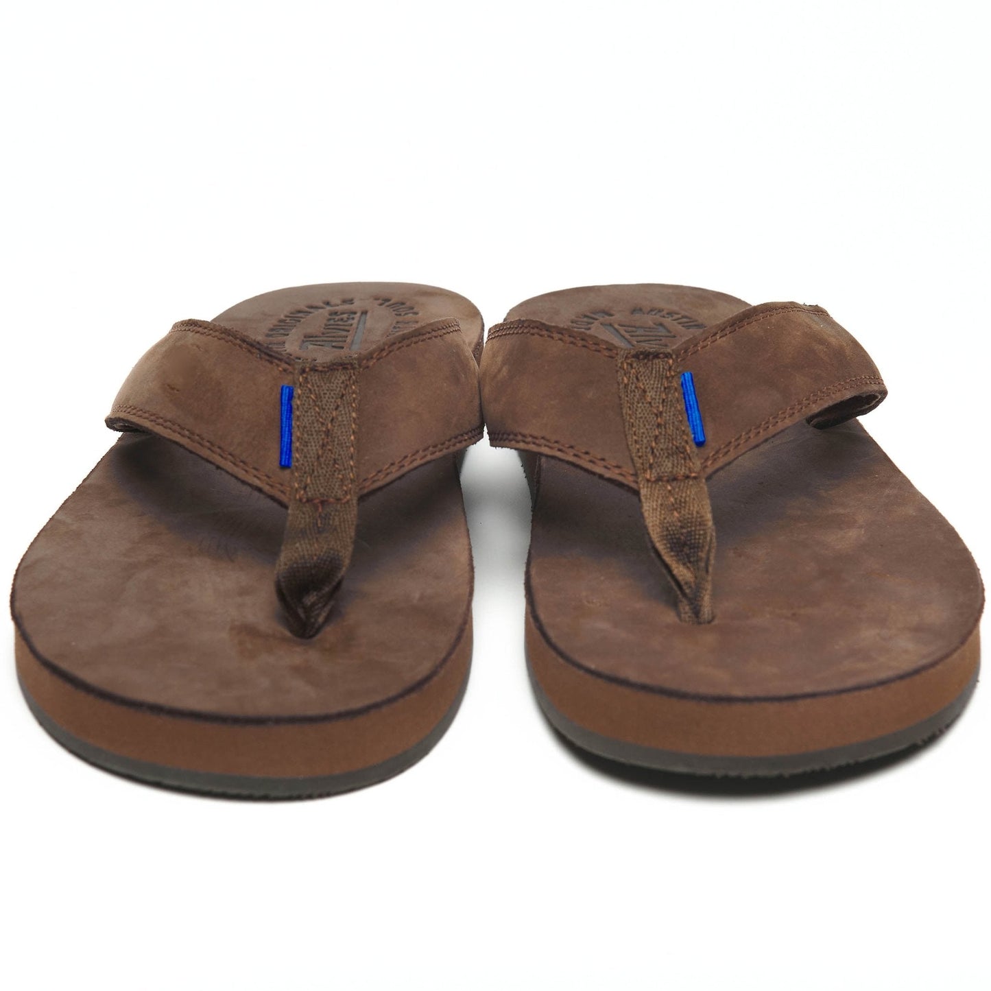 Brown thong sandals with blue accent stitching, front view