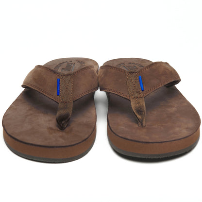 Brown thong sandals with blue accent stitching, front view