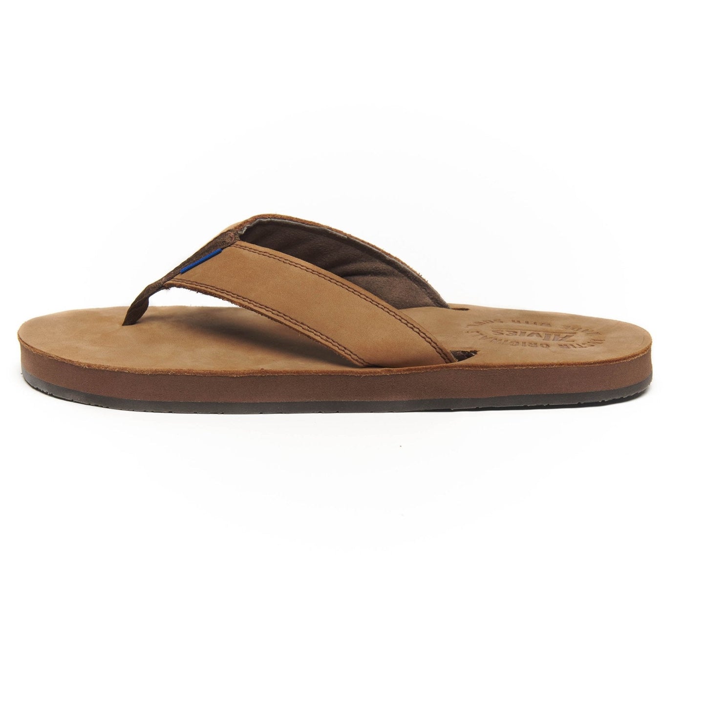 Tan suede flip-flops with black thong straps and low-profile rubber sole.