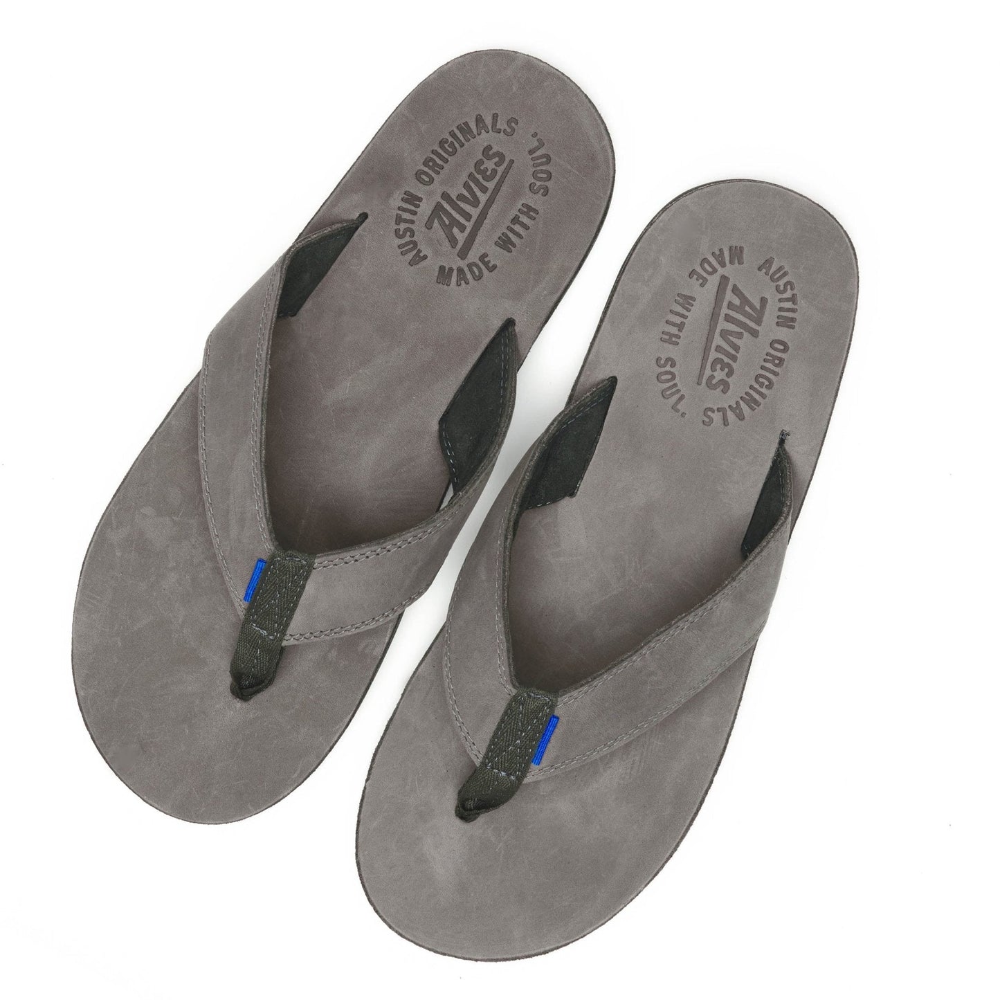 Gray suede flip-flops with black thong straps and blue accent, top view pair