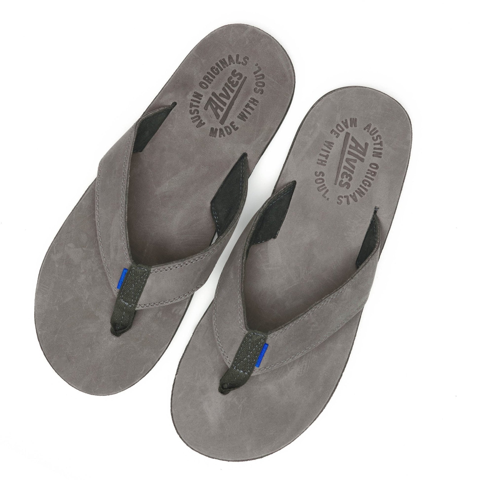 Gray suede flip-flops with black thong straps and blue accent, top view pair