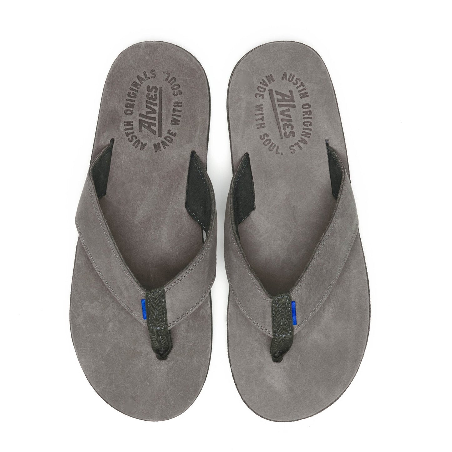 Gray suede flip-flops with black thong strap and blue accent on the straps