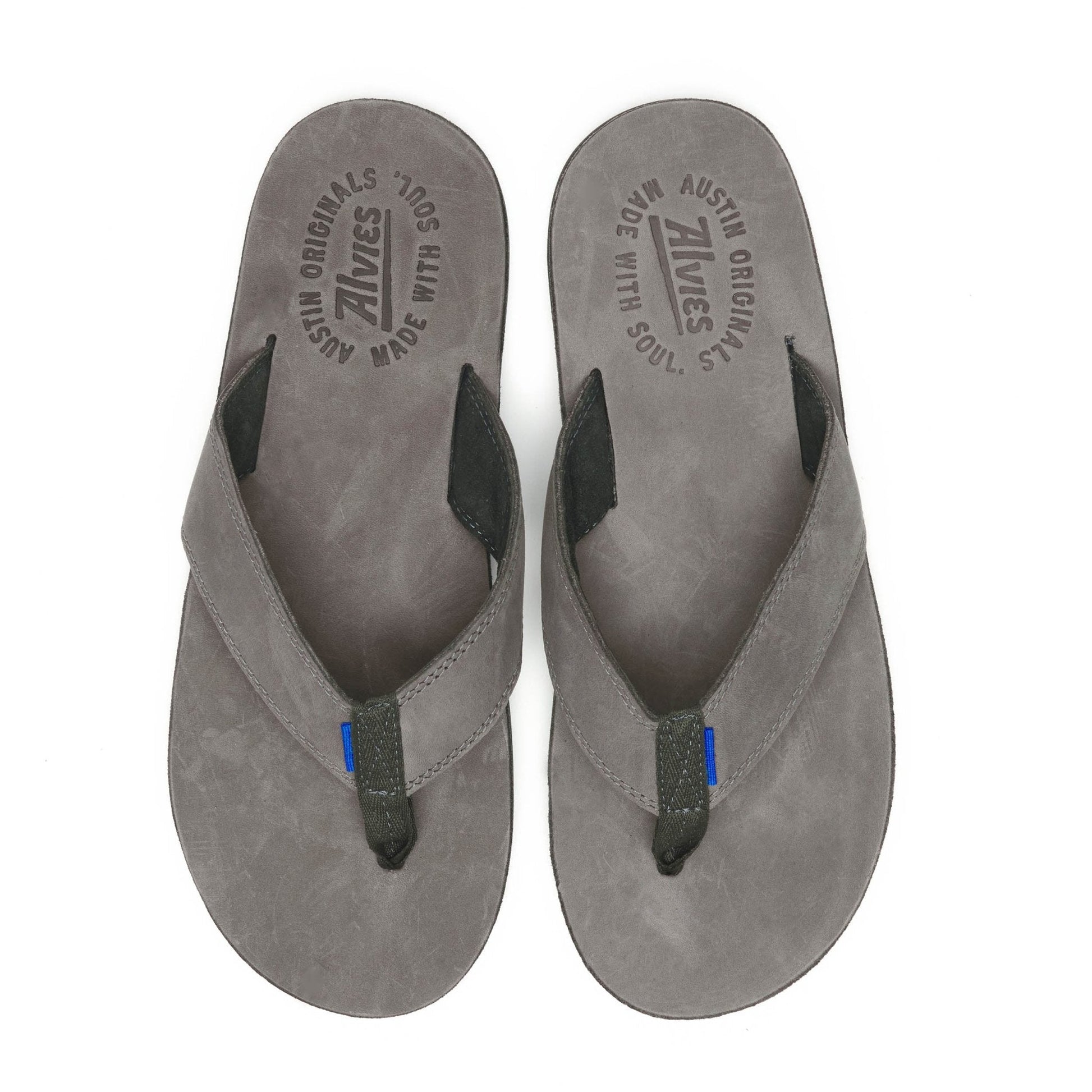 Gray suede flip-flops with black thong strap and blue accent on the straps
