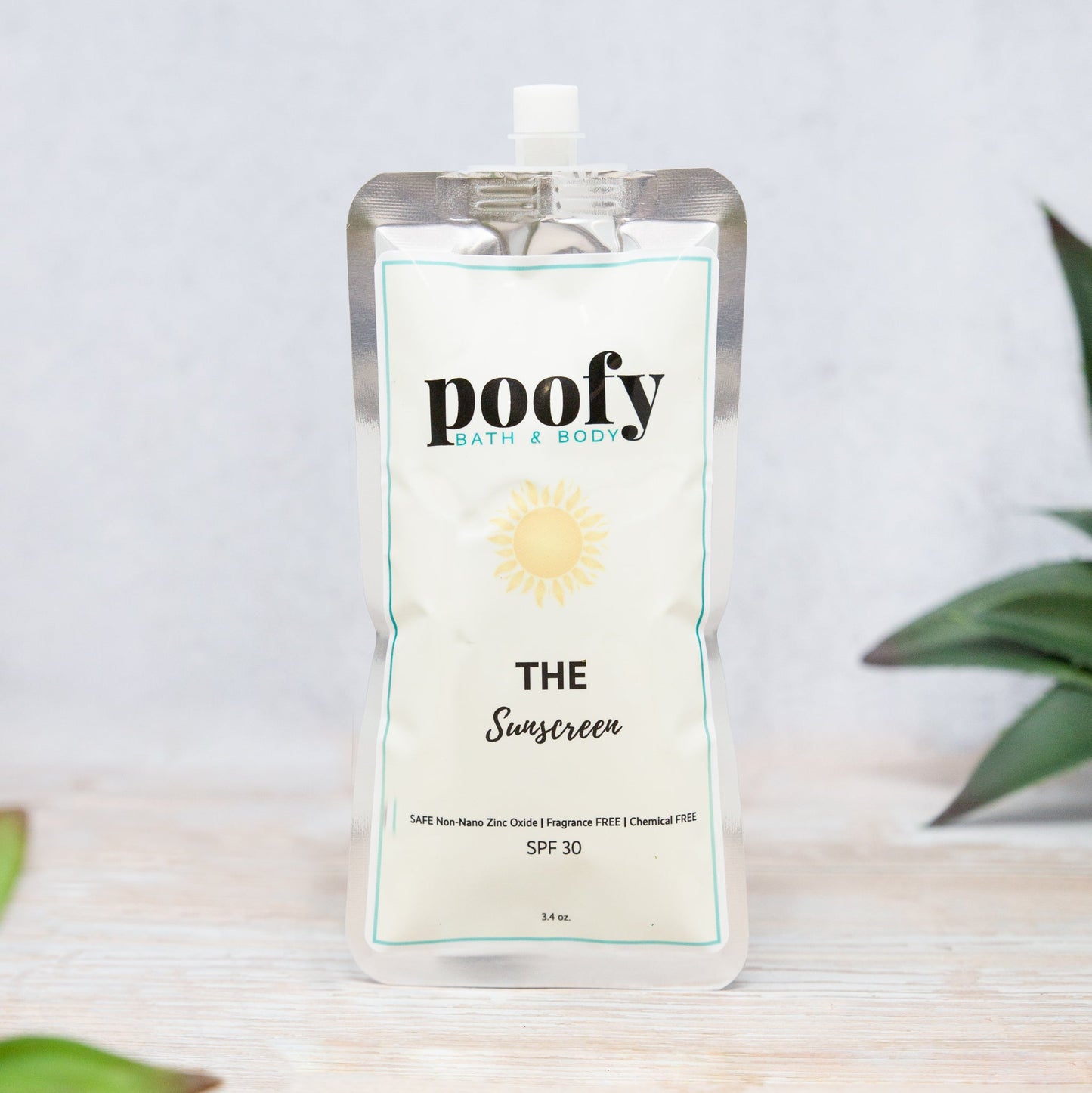 Sunscreen pouch with white label, SPF 30, and flip-top spout
