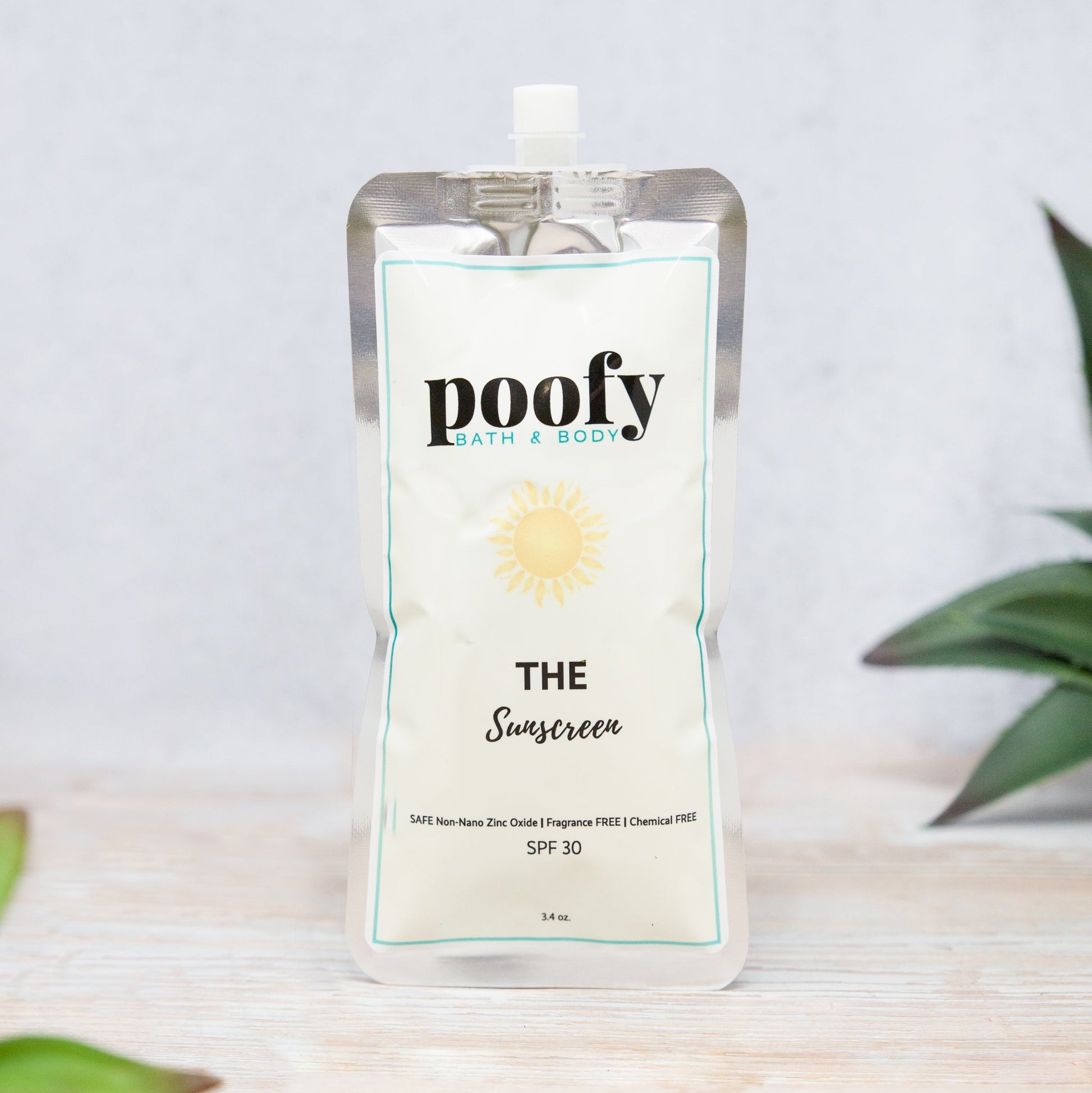 Sunscreen pouch with white label, SPF 30, and flip-top spout