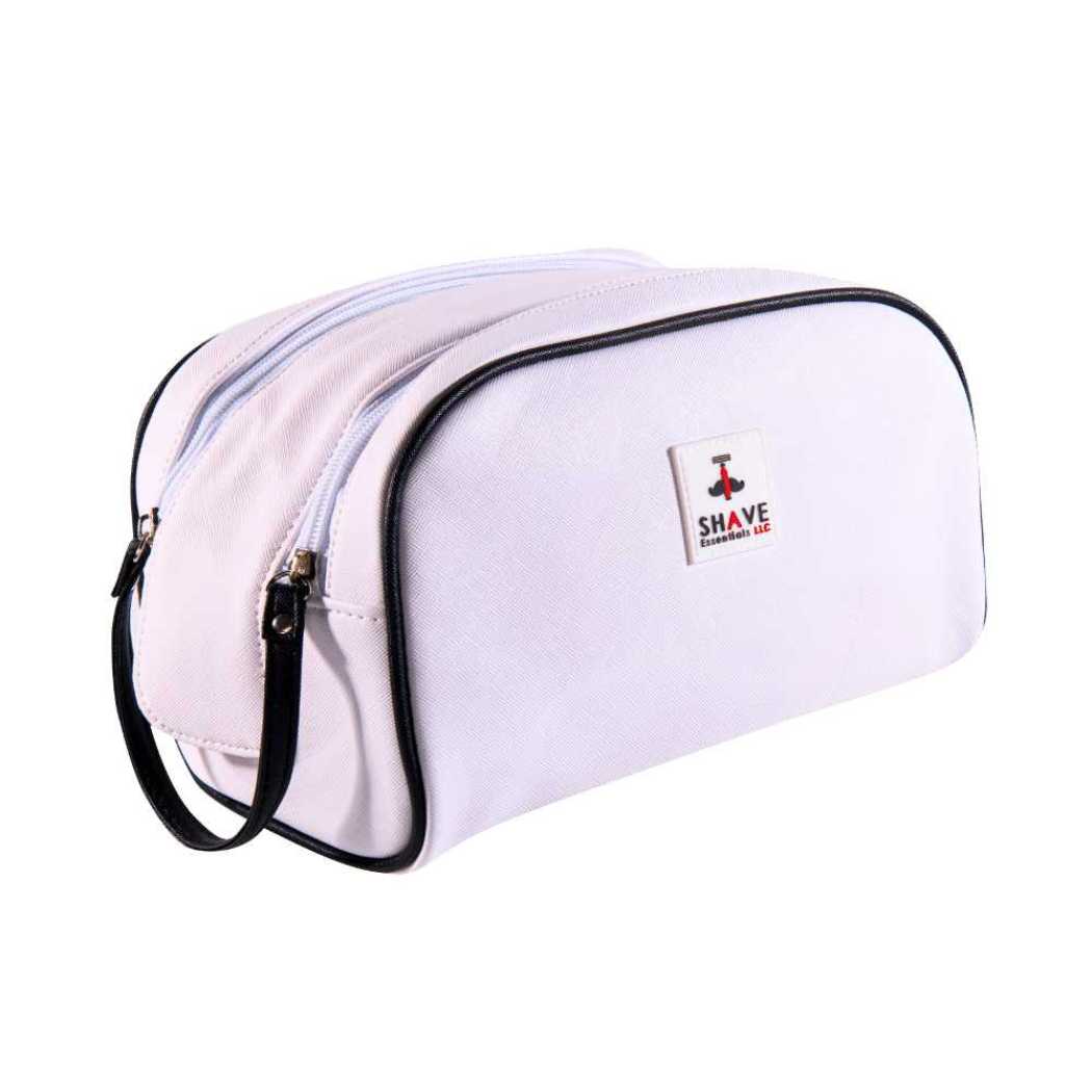 Light pink toiletry bag with black zipper and curved handle, front logo patch