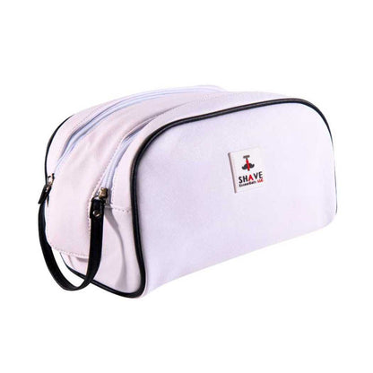 Light pink toiletry bag with black zipper and curved handle, front logo patch