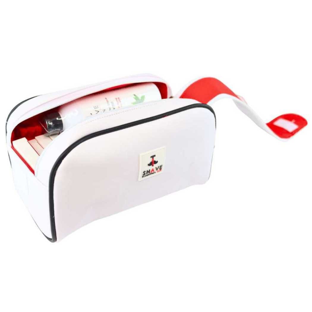 White toiletry bag with red lining, black-trim zipper opening and front logo patch