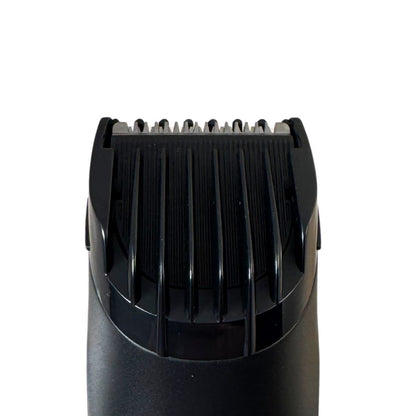 Hair trimmer cutting head with black comb teeth and blade housing