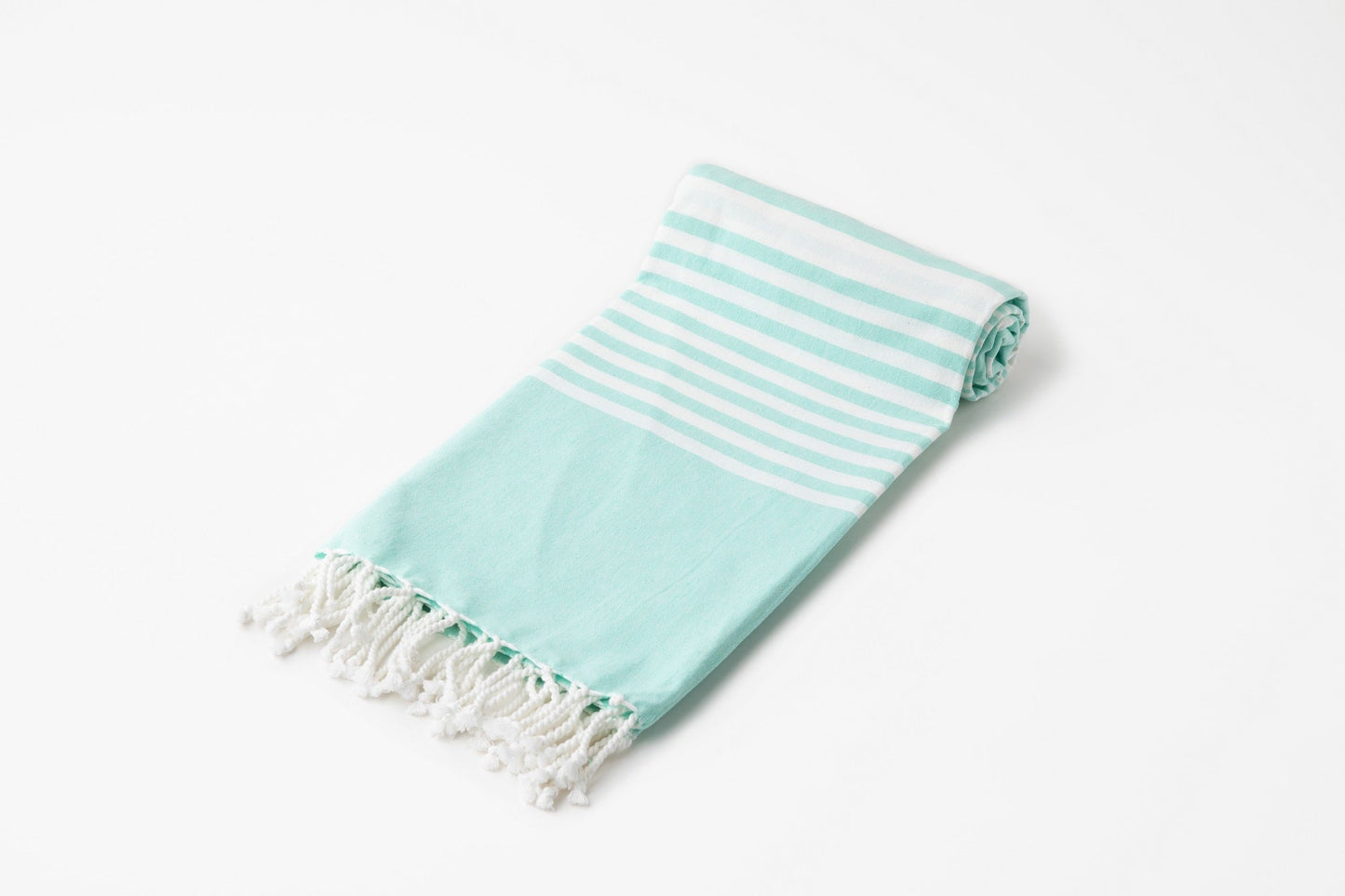 Turkish beach towel in aqua with white horizontal stripes and fringe ends