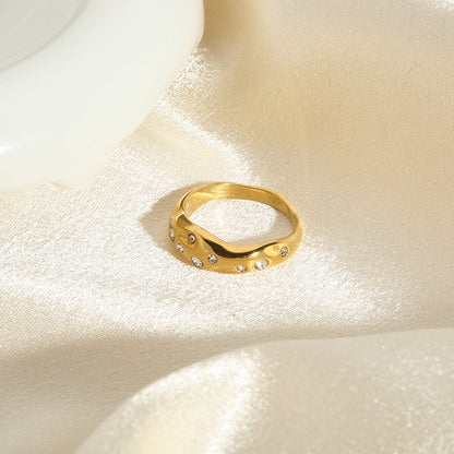 Gold snake-shape ring with clear stones, diagonal side view