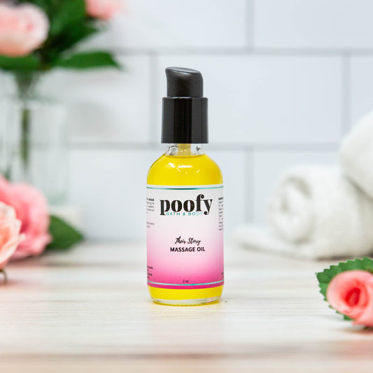 Massage oil bottle with black pump; yellow bottle with pink gradient label.