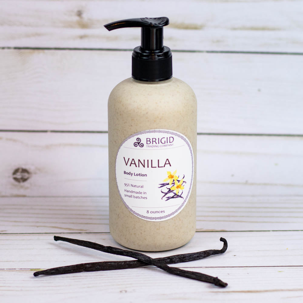 Vanilla body lotion bottle with black pump in a beige bottle