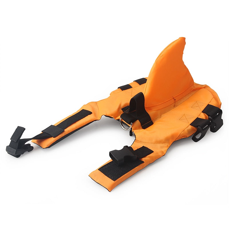 Dog life vest in orange with black adjustable straps and front D-ring