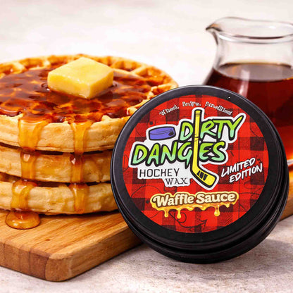 Hockey stick wax tin with round black lid and red Dirty Danges label, Waffle Sauce.