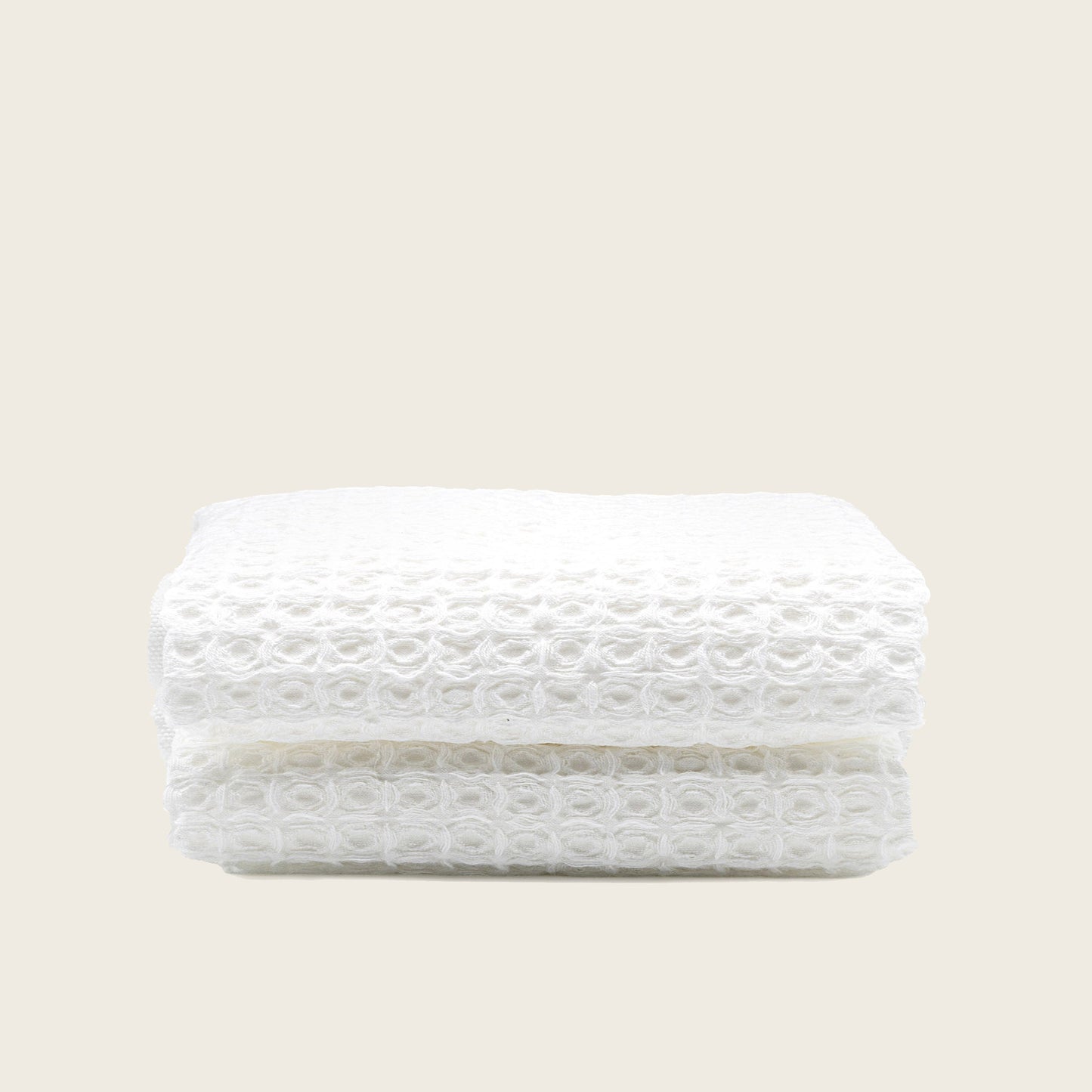 Australian cotton waffle towels in white, folded with textured waffle surface