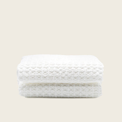 Australian cotton waffle towels in white, folded with textured waffle surface