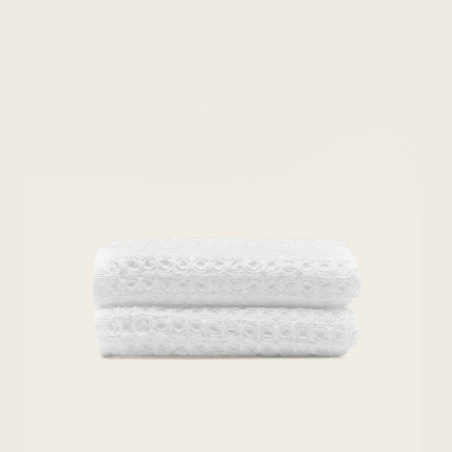 Australian cotton waffle towels in white, folded and stacked