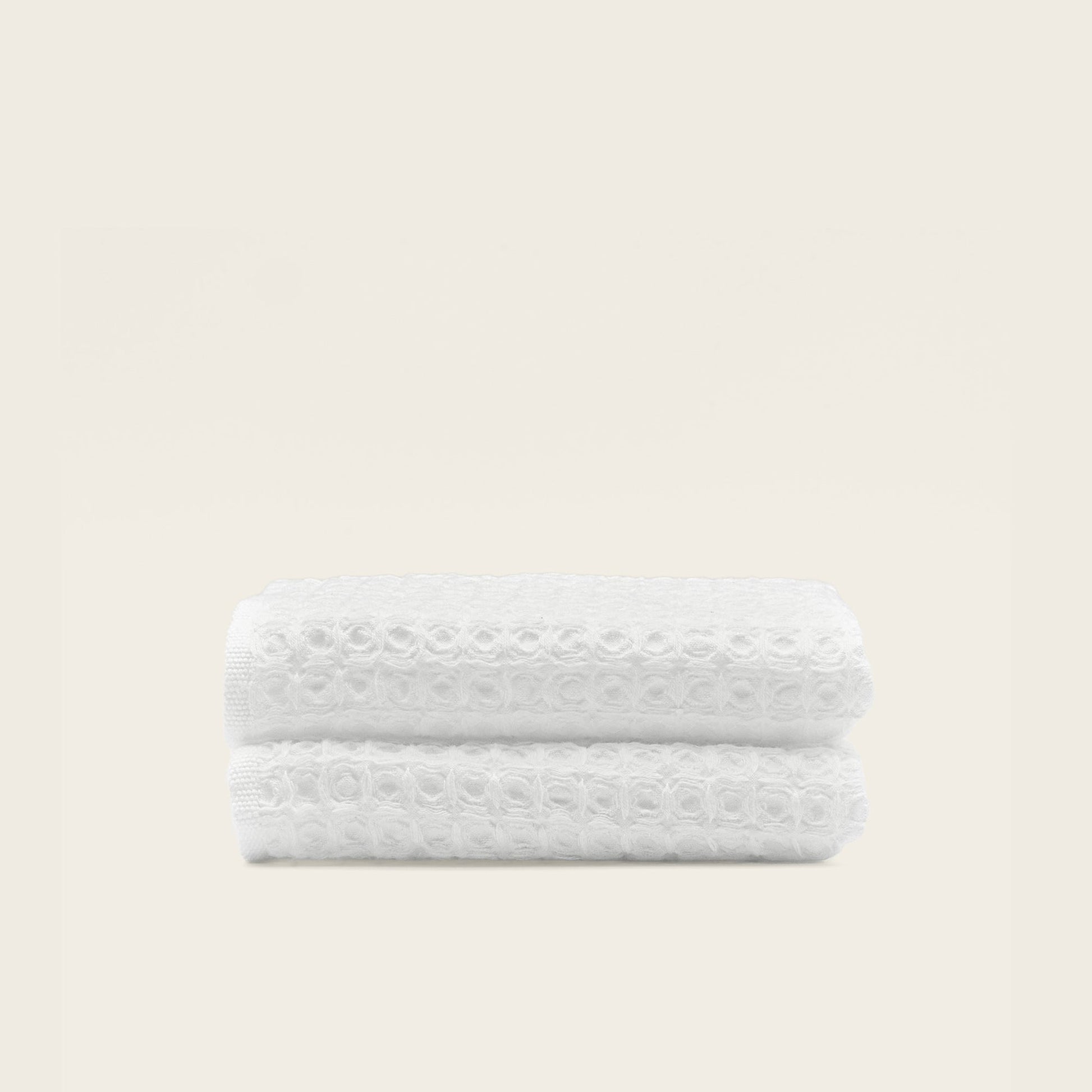 Australian cotton waffle towels in white, folded and stacked