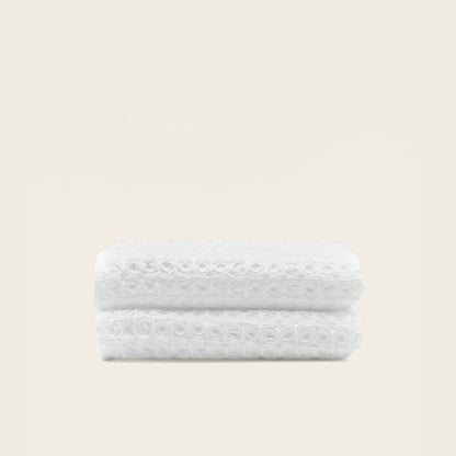 Australian cotton waffle towels in white, folded and stacked