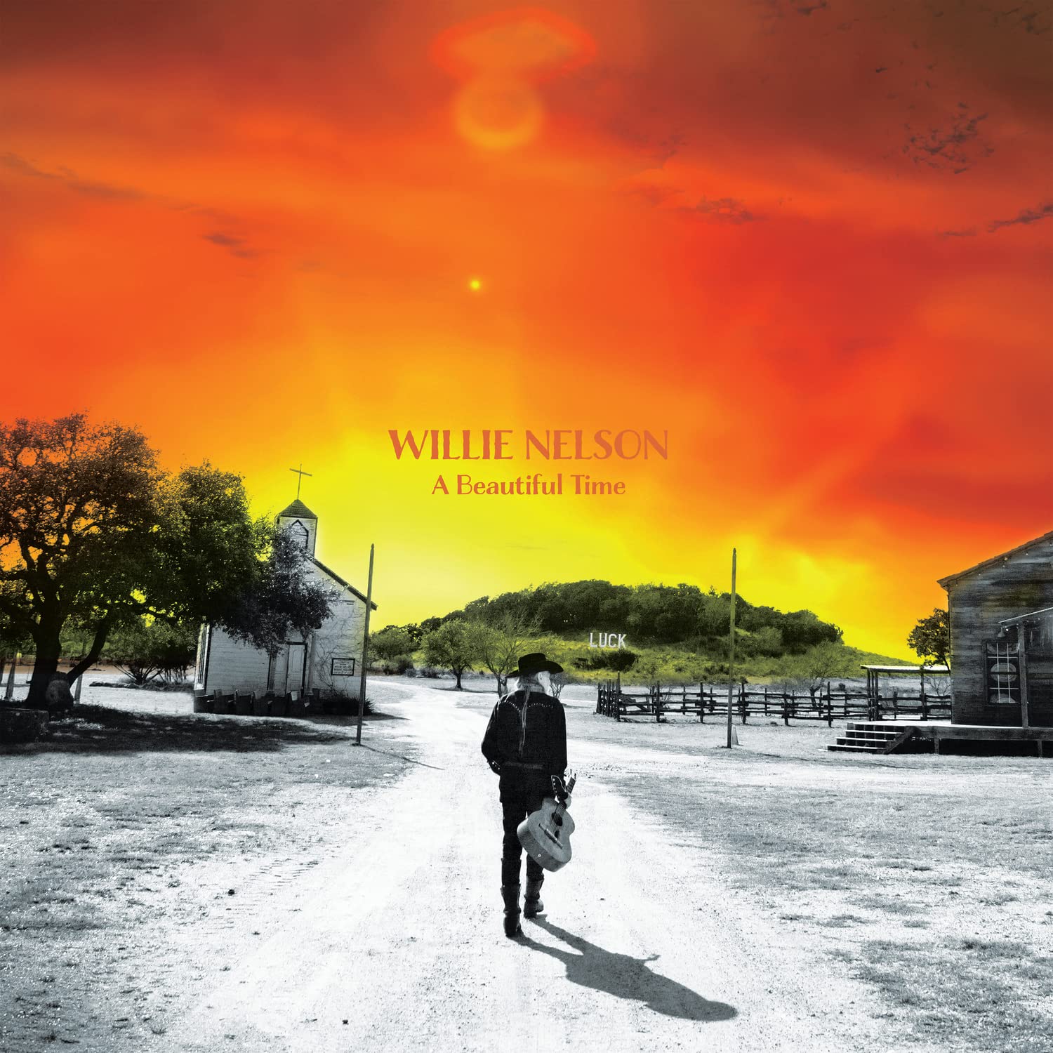 Vinyl album cover for Willie Nelson A Beautiful Time, sunset landscape with walking person