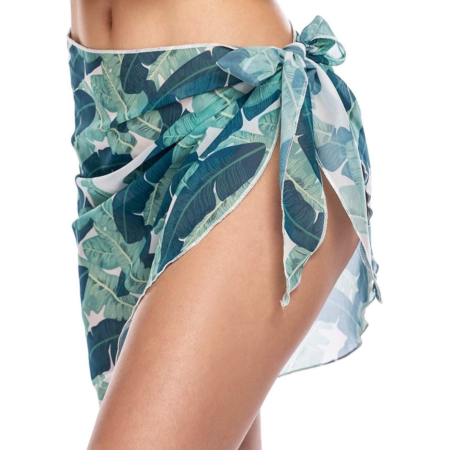 Short sarong beach wrap in teal leaf print, tied at the hip with long bow ends