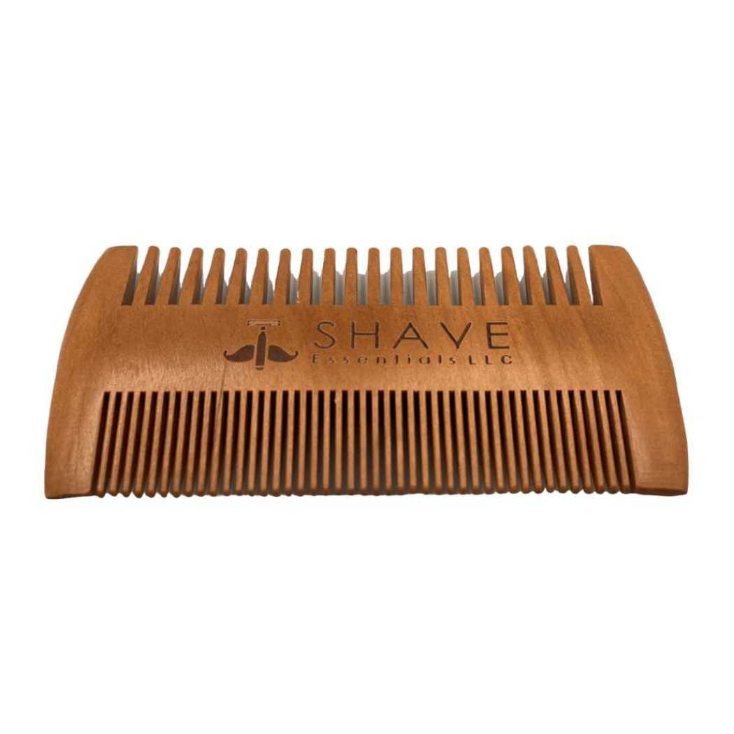 Wooden beard comb, rectangular shape, fine teeth across top and bottom.