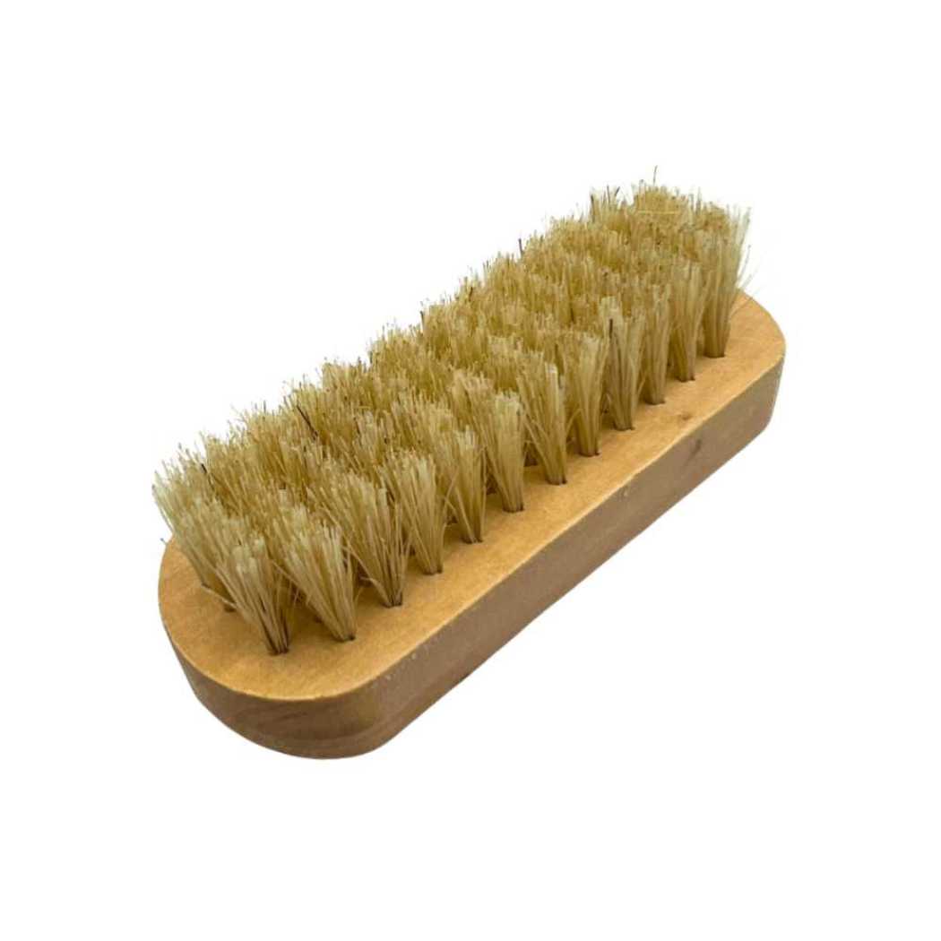 Wooden nail brush angled view with dense tan bristles on light wood base