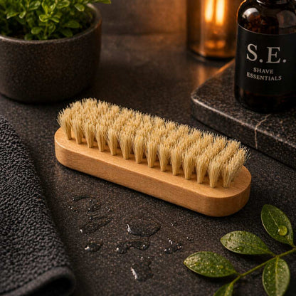 Wooden nail brush with tan stiff bristles and rounded wooden handle block