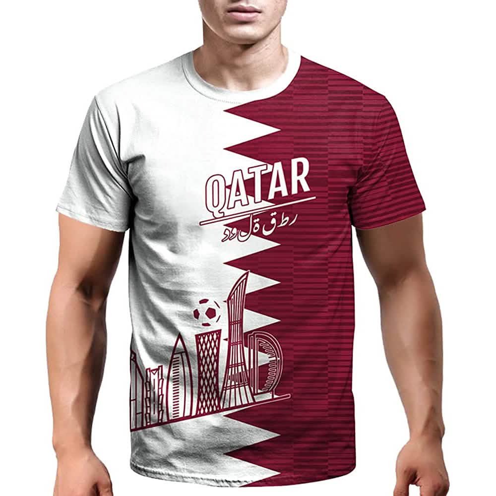 Qatar soccer jersey with white base, maroon side panel, “QATAR” text, and city skyline graphic.