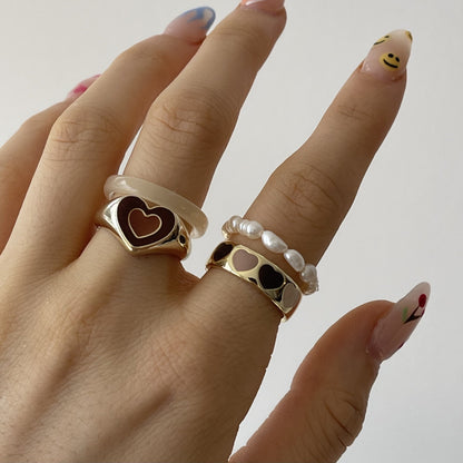 Heart enamel ring with dark red heart inset on gold-tone band