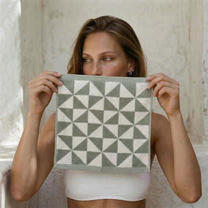 Geometric cotton towel in sage and ecru with triangle pattern