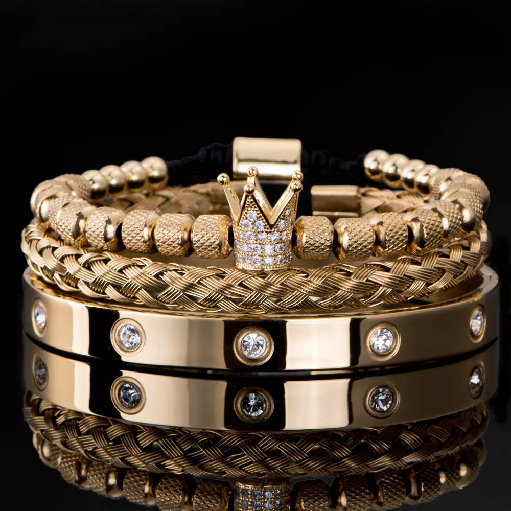 Gold braided Roman bracelet with diamond studs and gold-tone crown centerpiece