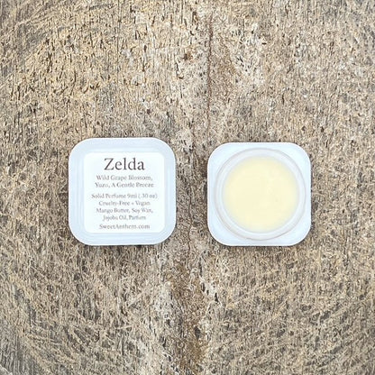 Zelda solid perfume jar with creamy balm in white plastic container