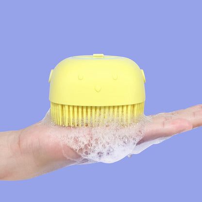 Yellow handheld dog bath brush with bristle head for scrubbing fur
